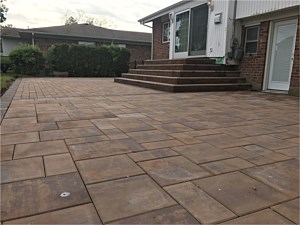golden brown nicolock alpine contemporary smooth modern patio brick pavers jericho u shape steps from sliding doors bullnose